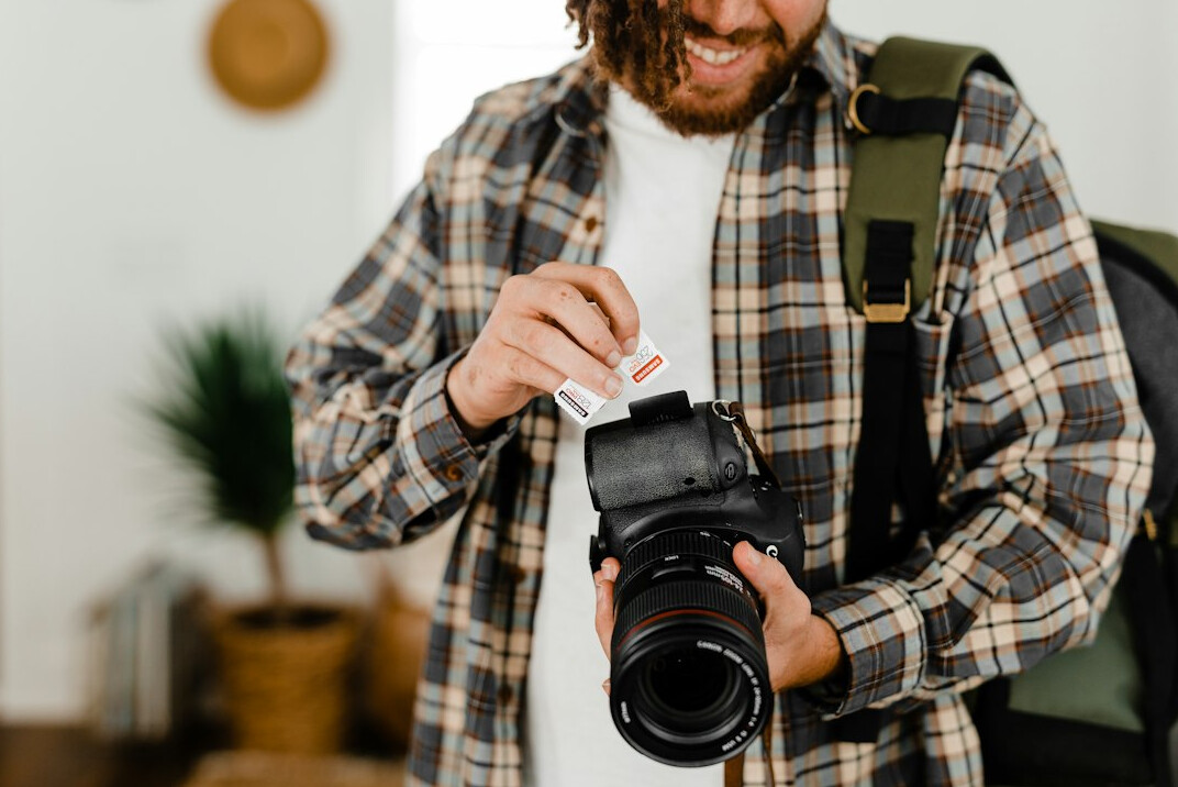 Photographer reviewing contact sheets and prints on a table
