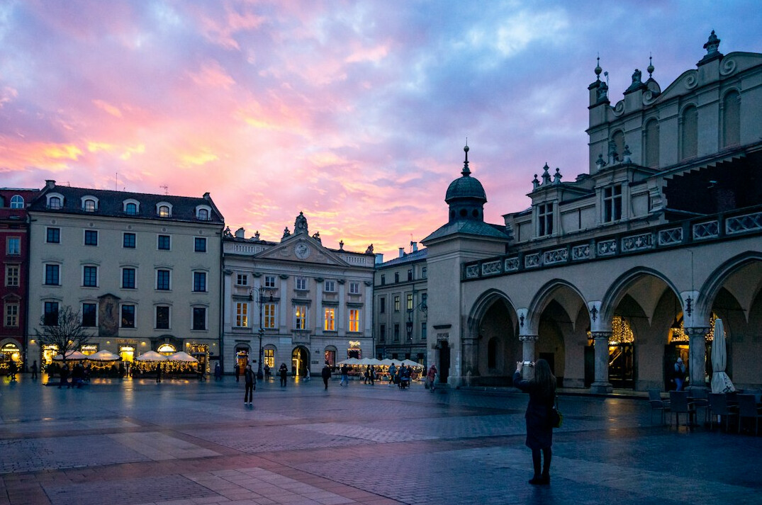 Documentary photographer taking photos in a Polish town square