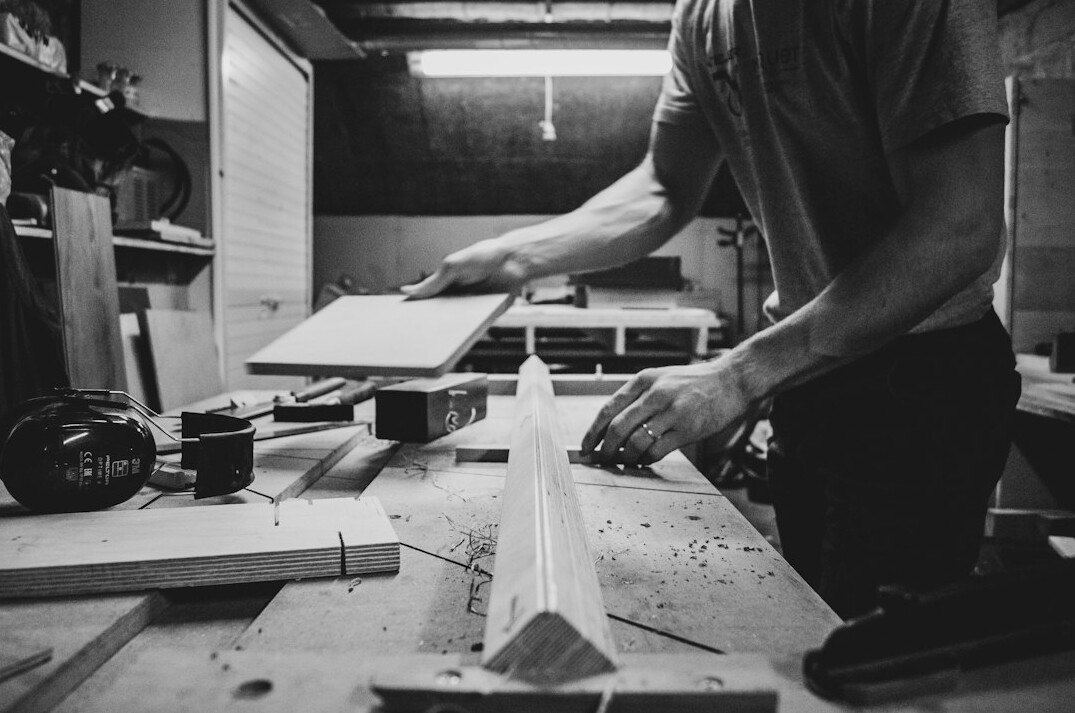Craftsman working with wood in a small workshop